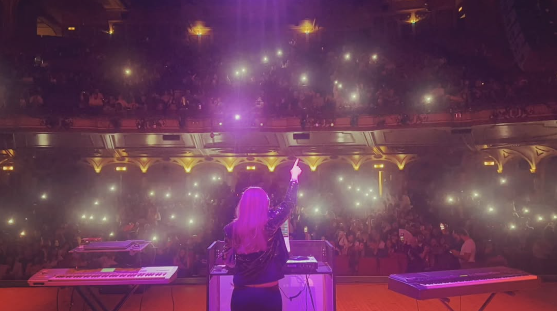 Arabic female DJ performing live on stage in Southern California